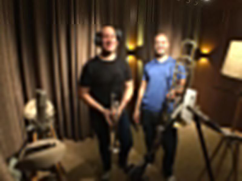 Matt Waters with a trombone at a recording session